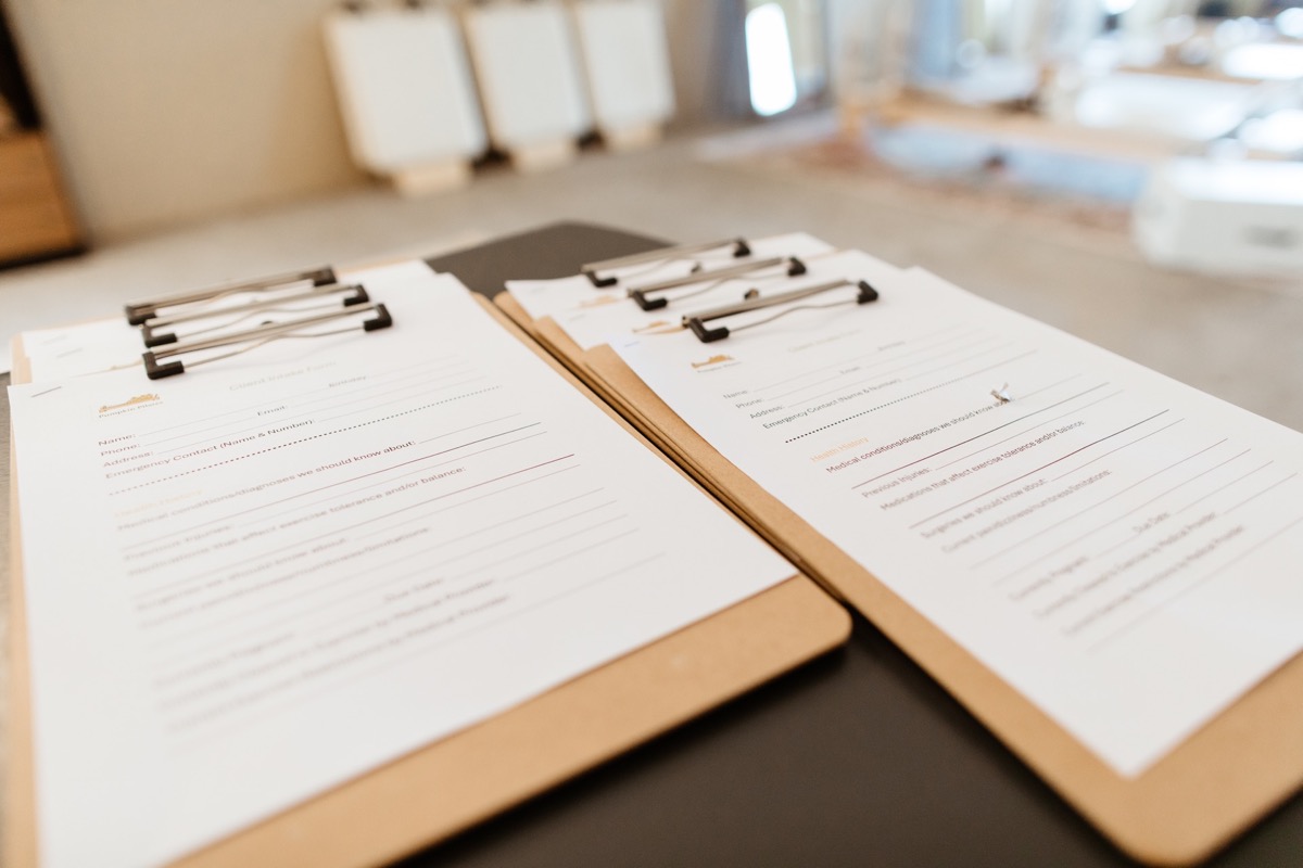 Intake forms on clipboards ready for new clients